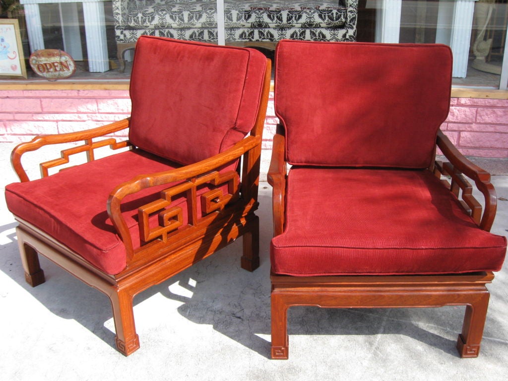 Fabulous pair of 40's rosewood Chinese Chippendales style Club Chairs. Wonderful quality and lines. Great patina and coloration.<br />
Feel free to call us at 305 562 2290 if you need to have these chairs lacquered or upholstered to spec. We will