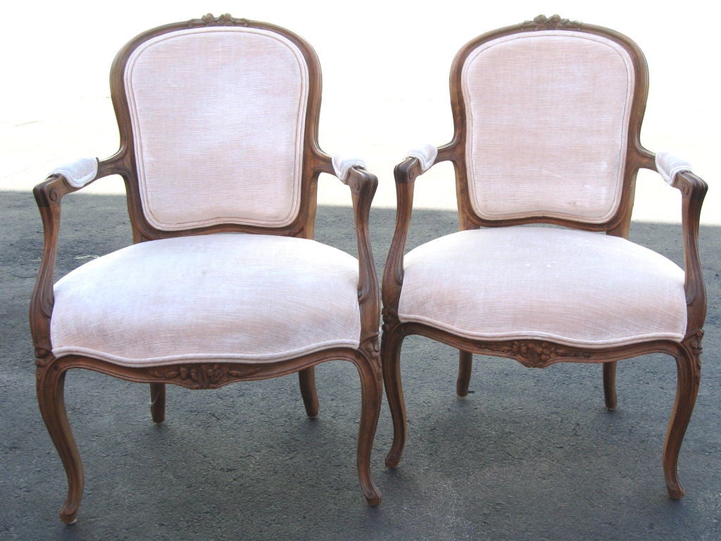 Pair of French Open Arm Bergeres, walnut frames. Wonderful for a salon, parlor, dressing room and bedroom. <br />
For additional chairs, armchairs, sofas, benches, tables, consoles, commodes, sideboards, paintings, sculptures visit our website: