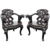 Exceptional Opposing pair of Antique Dragon Armchairs