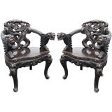 Exceptional Opposing pair of Antique Dragon Armchairs