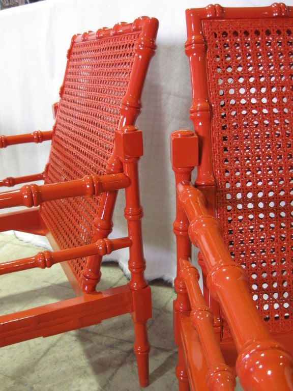 Spectacula pair of Faux Bamboo, High gloss lacquered double canned back club chairs/armchairs.<br />
Wonderful form, slant backs, large seating area.<br />
For additional chairs, end/coffee tables, benches, sofas, consoles, cabinets, chests,