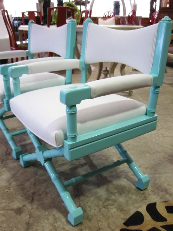 Beautiful Pair of High Gloss Lacquered armchairs, upholstered white Sunbrella. Faux Bamboo carved wood. Very comfortable seating, tight frames.<br />
For additional, chairs, benches, sofas, clubs, setees, bureaus, dressers, cabinets,  chests,