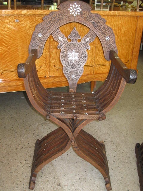 Rare pair of Moroccan wedding chairs. Male and female chair,intricate carving, mother of pearl inlay. Beautiful patina.