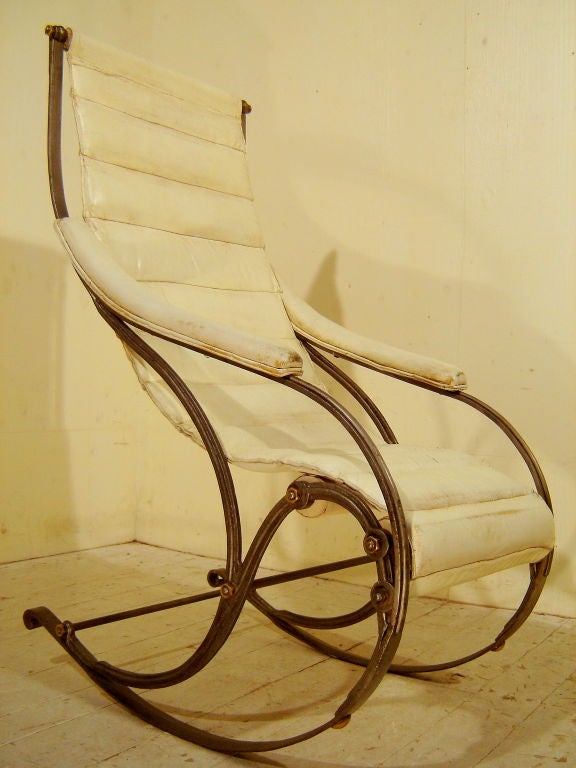 English A cast iron and leather rocking chair by Winfield For Sale