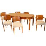 An Art Deco Walnut dining suite of 6 chairs and a table.