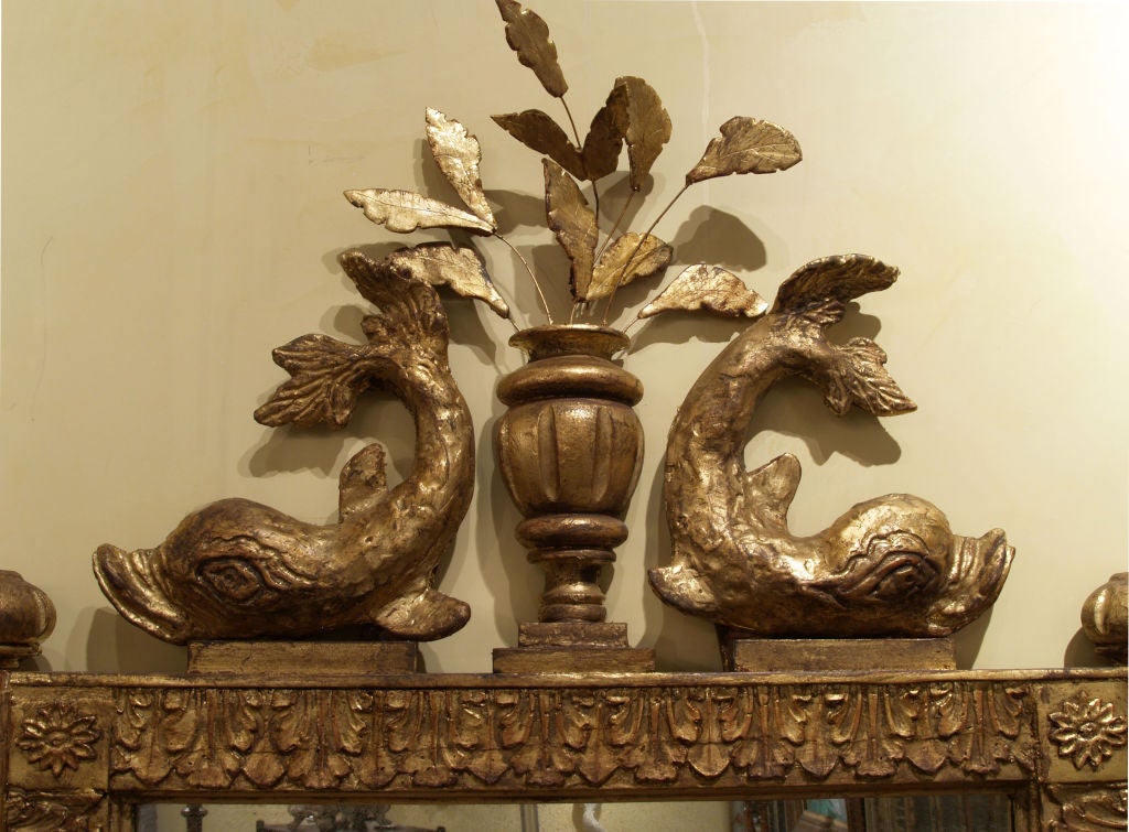 1105 A pair of Italian style Dolphin mirrors