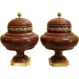 1087- A pair of French Louis XVI marble urns