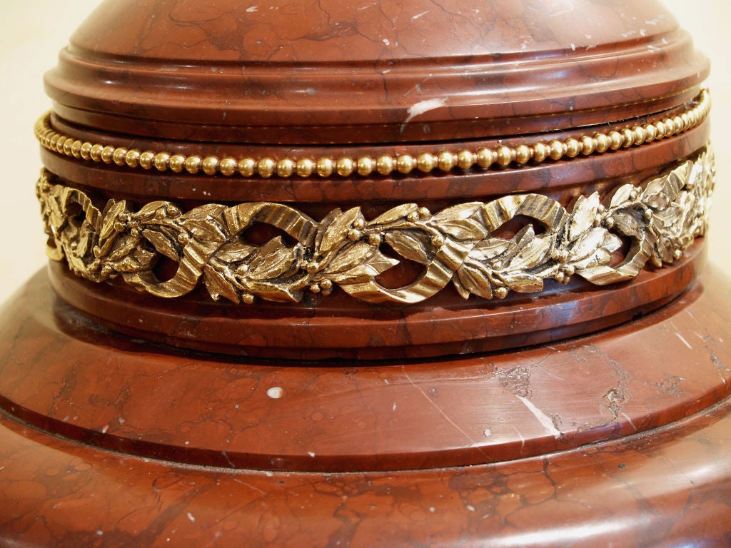 1087- A pair of French Louis XVI marble urns