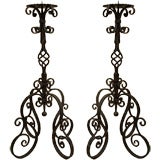 1131- A pair of Italian wrought iron candelabra