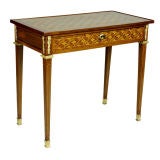 A Louis XVI Ormolu-Mounted Tulipwood, Amaranth, Mahogany Table