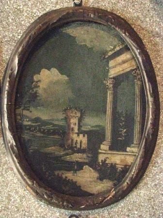 Set of four 19th century Italian oil paintings in original carved wooden oval frames, old gilt.  Scenes depicting romanticized ruins of ancient architecture and landscapes in muted and grayed blues.