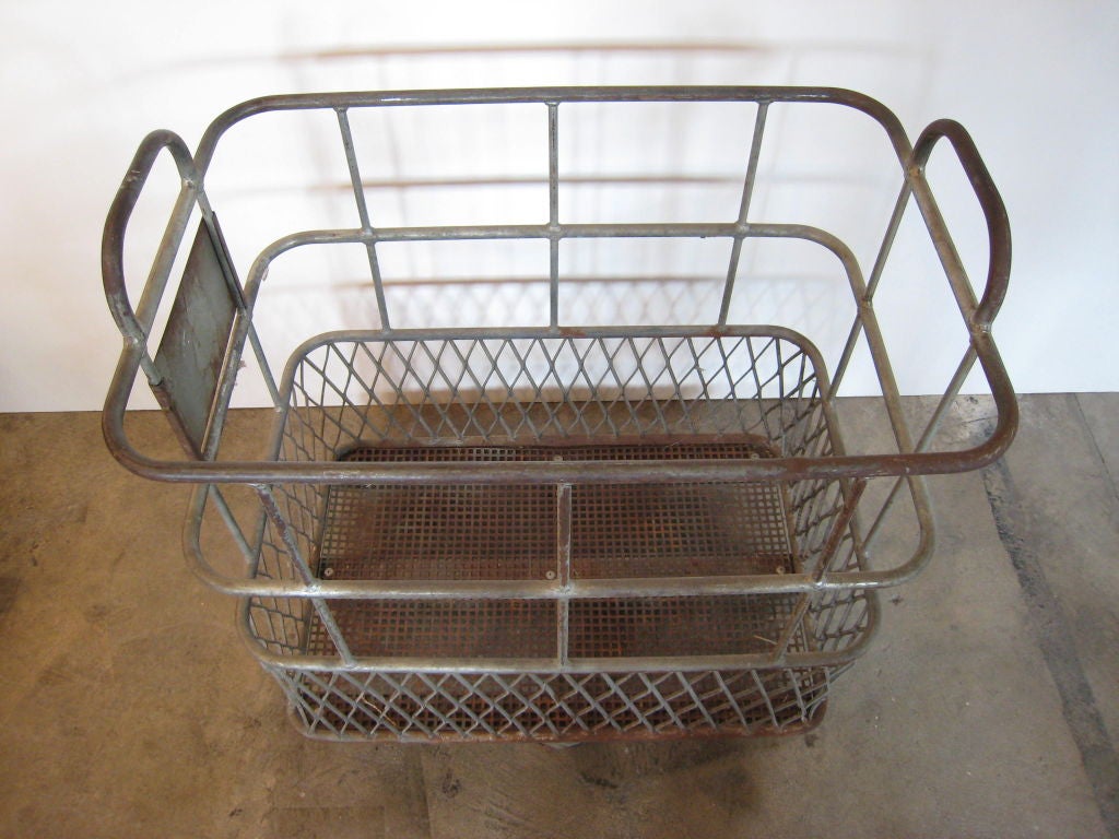vintage industrial steel basket on wheels