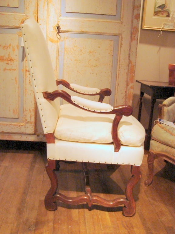 Handsome Walnut and Chestnut Louis XIII Os de Moton Arm chair.Arched back and padded arm.