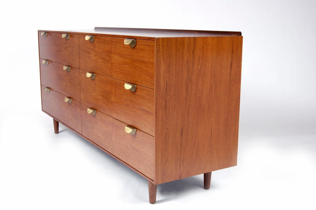 Six drawer chest in walnut with brass pulls. Made for Baker. Metal label in drawer.