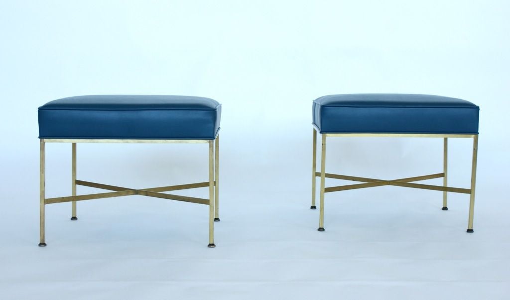 Paul Mc Cobb for Directional X base Ottomans/stools.Reupholstered in blue Edleman hand-dyed leather. Nice original patina on brass.