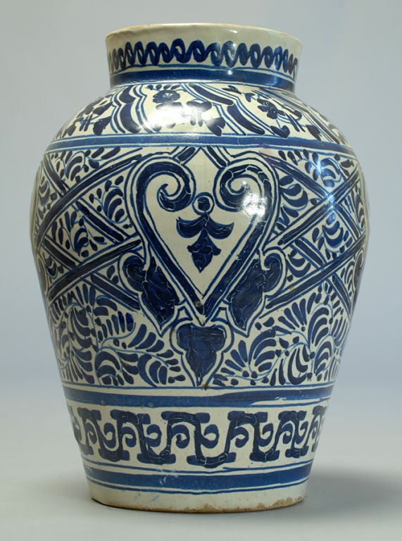 A rare 19th century Mexican Talavera Poblana blue on white jar with cobalt blue foliate and geometric motifs over a milky white slip. <br />
<br />
Dimensions: 11 inches high x 9 inches diameter.
