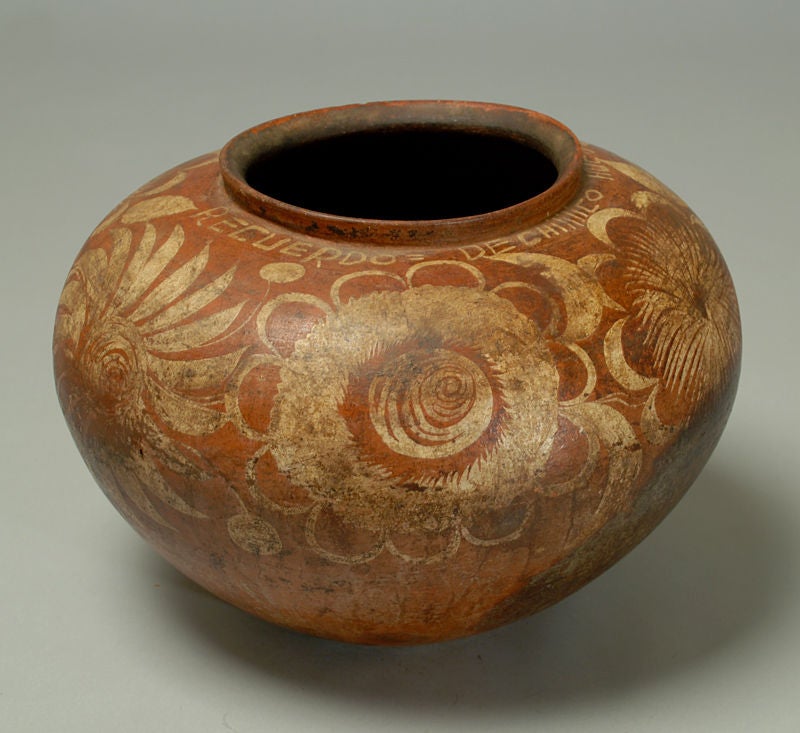 A superb late 19th century Huasteca widemouthed earthenware pot with polychrome painted foliate motifs. Inscribed: 