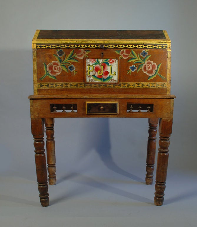 This bright and cheerful early 20th century, circa 1930, Mexican cedar-wood wedding chest from Puebla is polychrome painted all over in deep shades of mustard yellow, rose, green, deep turquoise blue, red, brown and black. The initials, PJL, are