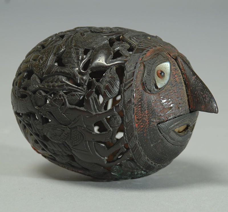 A superb 19th century hand carved Mexican coconut bank with exceptional scrimshaw carving. This 