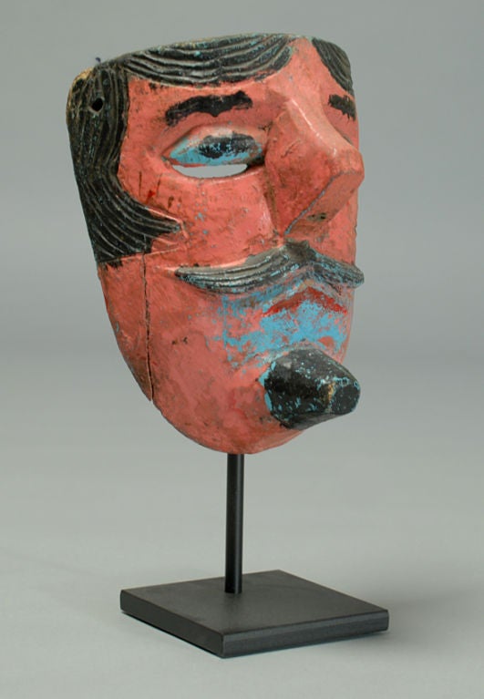 A good early 20th century mustachioed Moro mask from the dance of the Christians and Moors. Veracruz, Mexico - circa 1940's. Displayed on a high quality custom made stand.

Dimensions: actual mask measures approximately 8 inches x 5 inches.