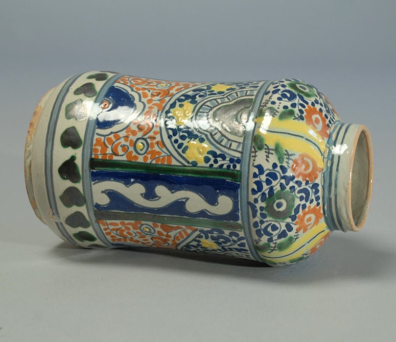 A handsome 19th century talavera tibor from Mexico. Dark cobalt, red, yellow and morisco green glaze over a milky white slip.<br />
<br />
Dimensions: 10 inches high.