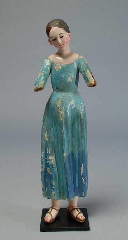 A charming early 19th century Santa Maria santo. Carved and polychrome painted wood with inset glass eyes. Displayed on a high quality custom made base.

Dimensions: overall height is 17