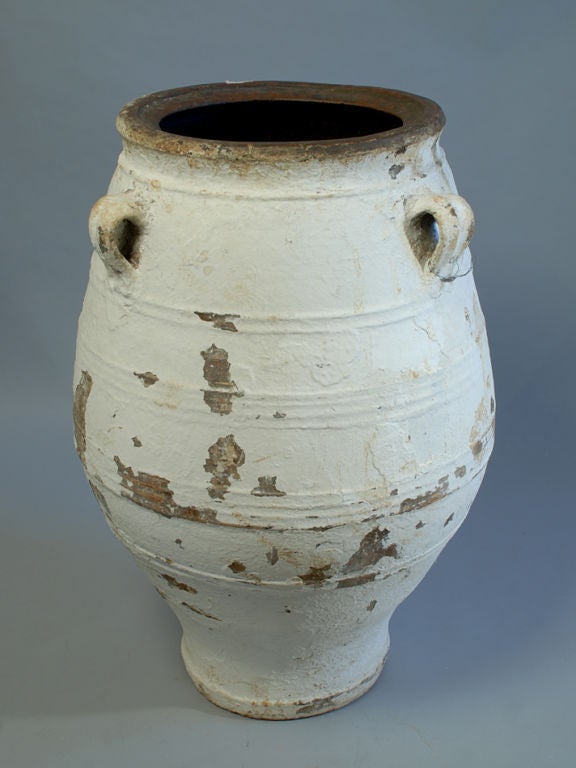 A large early 19th century Greek olive jar -- ribbed with original white surface paint. <br />
<br />
38 inches tall x 26 inches diameter.