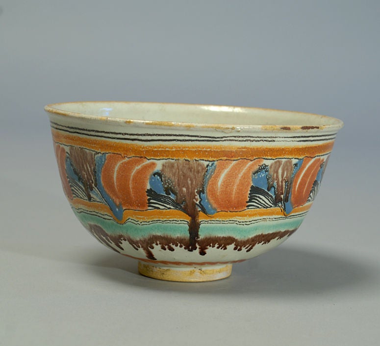 A very good, large 19th century talavera bowl (Puebla) with copper green, terra-cotta red, pale blue and manganese over milky white slip.<br />
<br />
Dimensions: 9 inches diameter x 5 inches high.