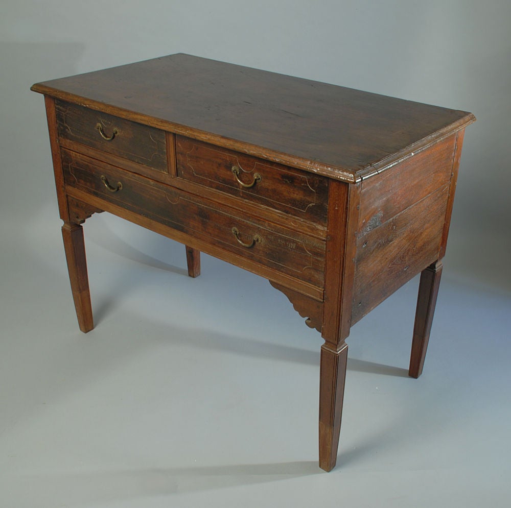 A handsome mid 19th century Filipino nara mahogany altar table with three large drawers.<br />
<br />
Dimensions: 36 inches high x 48 inches long x 25 inches deep