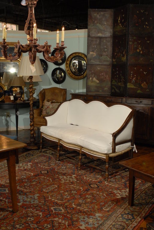 French rush seat bench with unusual bergere arms, circa 1850
