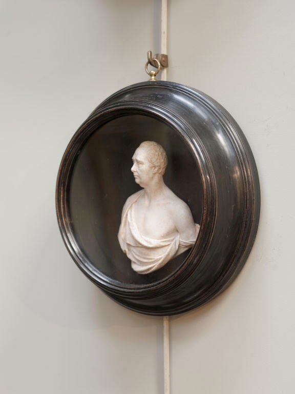 A group of three wax high-relief portraits by Samuel Percy, dated 1804.<br />
Comprising: The Hon. William Pitt, The Hon. Charles James Fox and another, each mounted in a circular ebonised frame, two with hand written ink labels to reverse.