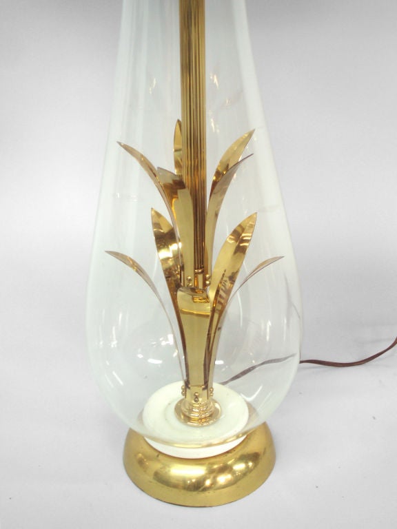 A brass and glass mad men table lamp as shown in Don and Betty Drapers bed room.
28 tall (base), priced without shade.