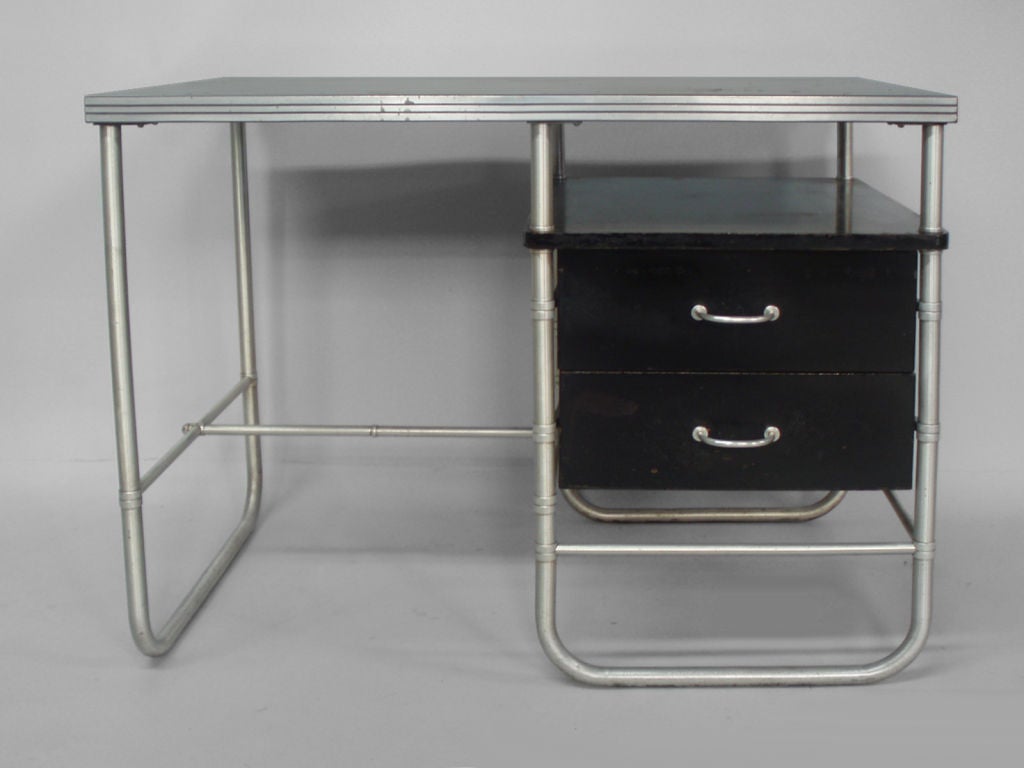 A Aluminum and Wood Desk by Warren MacArthur for MacArthur Co.<br />
(retains water decal label)