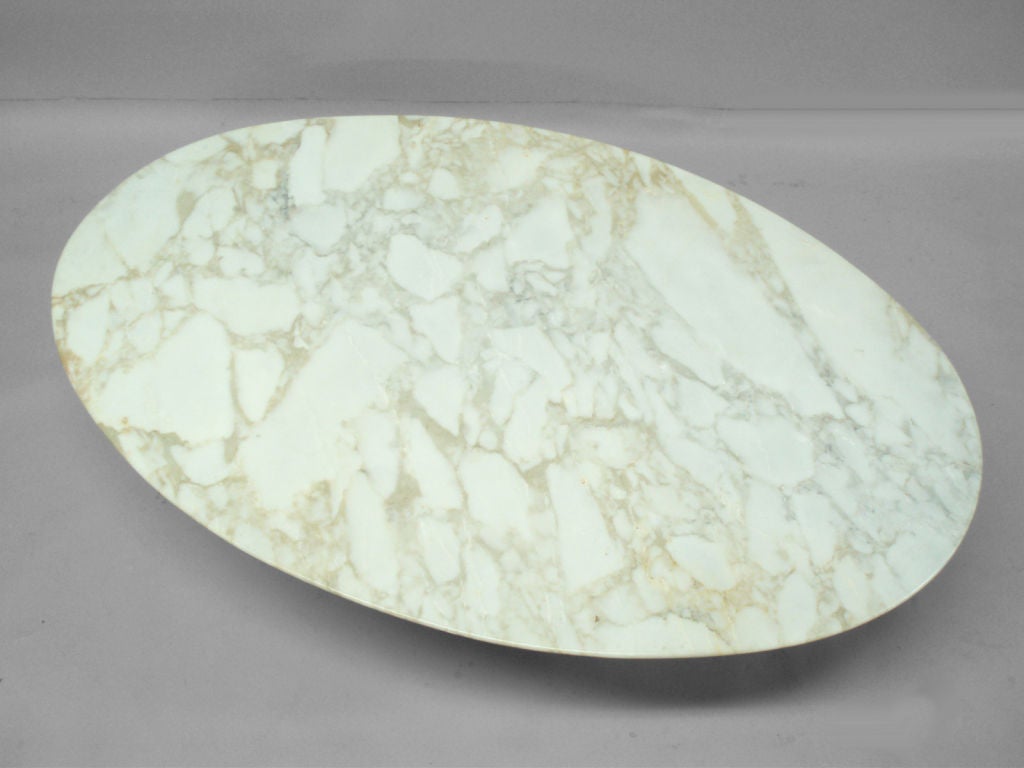An Oval Marble Top Table with Iron Base by Eero Saarinen