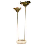 A 20TH century brass lotus floor lamp with a Travertine Base