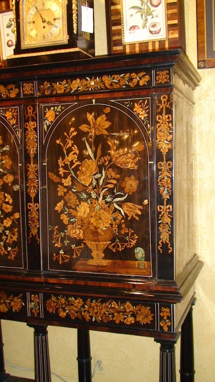 EXCEPTIONAL DUTCH MARQUETRY CABINET ON STAND, INLAID WITH IVORY AND VARIOUS WOODS.