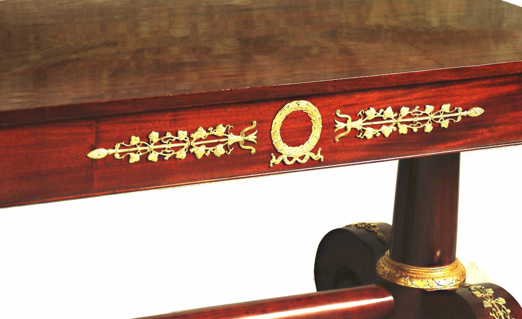 FRENCH EMPIRE STYLE BRONZE MOUNTED AND PARCEL GILT MAHOGANY TABL