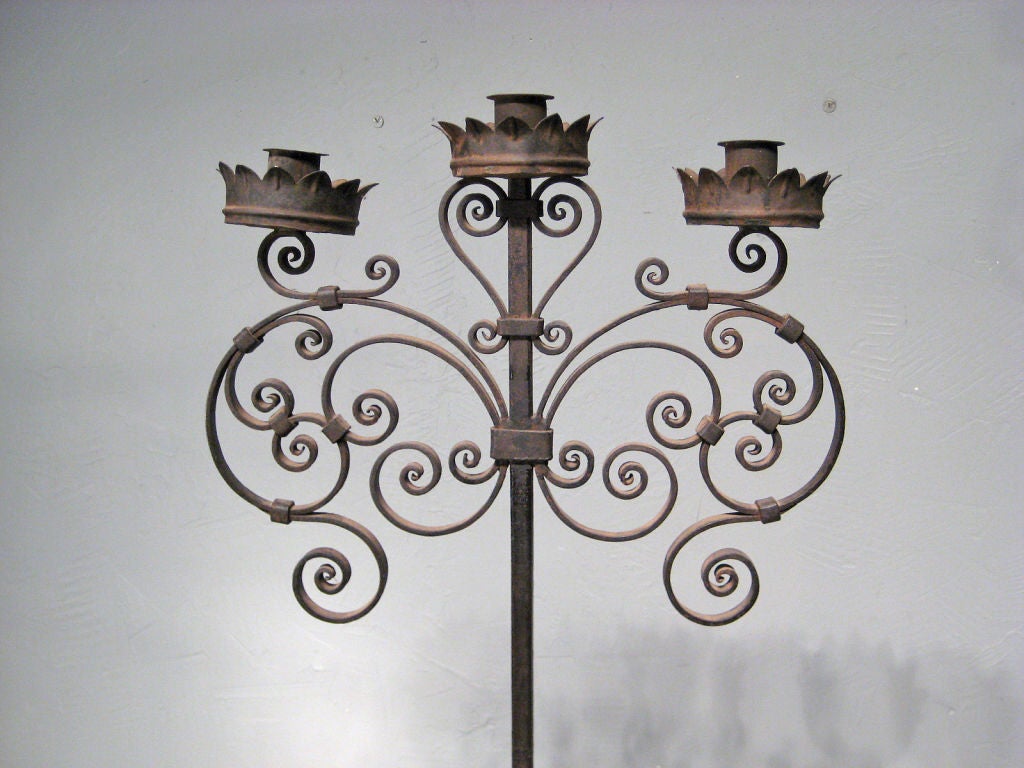 French wrought iron floor candelabra. Perfect for use as a garden decoration or to light a patio at night. More photos available upon request. More antiques available at www.ofleury.com