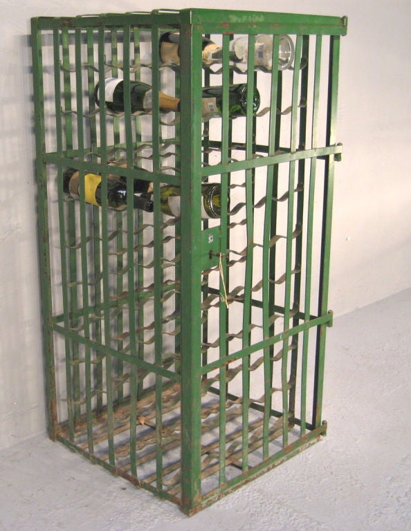 Traditional enclosed wine rack with one door that can be locked. 100 bottle capacity. Perfect for that special wine cellar or tasting room. More French Antiques at www.ofleury.com