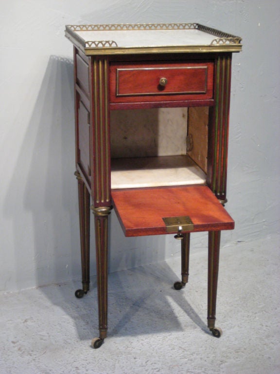 Elegant French night stand made of mahogany with brass inlay. Full size bed and an armoire are available separately.<br />
Special price of $ 5000.- for the bedroom set ( armoire-bed-night stand)
