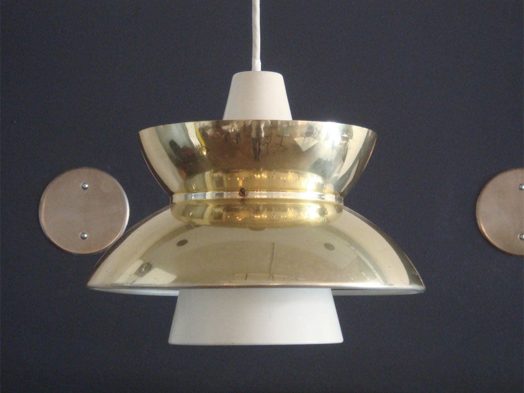 single Jørn Utzon pendant light, brass plated cover shade over white enameled cone