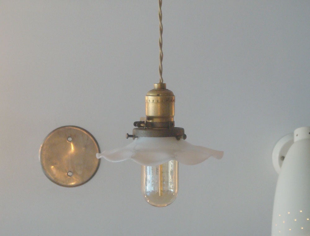 1920's waved milk glass shades<br />
priced per pendant @ $600<br />
vintage sockets and fitters<br />
rewired, new Edison filament bulbs