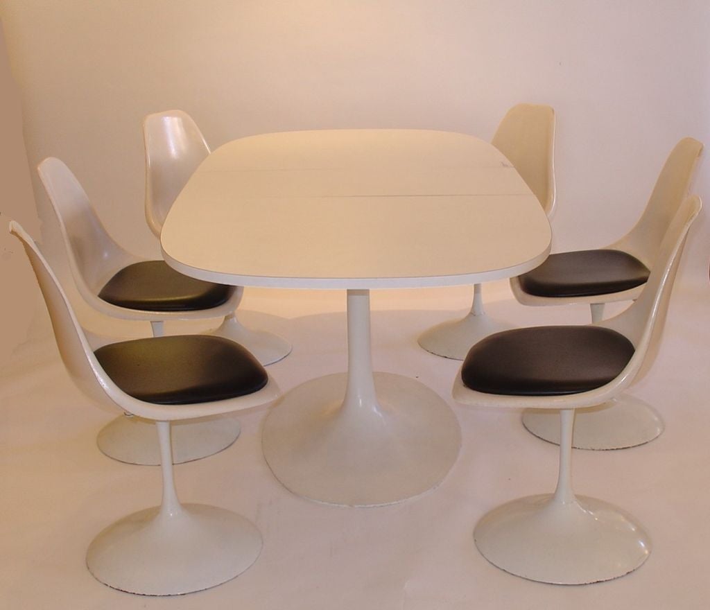 Burke Saarinen Style Tulip Table with Six Chairs. The table has two 14 inch leaves. When fully extended the Table is 82 inches long.