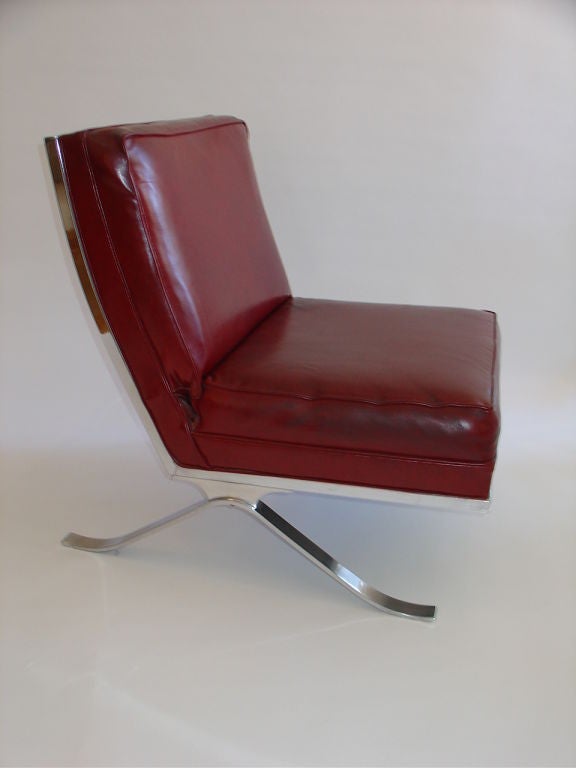 Elegant Mies van der Rohe inspired chrome Barcelona style chrome lounge chair.
A great alternative to the classic Barcelona chair.
The chair still retains its original vinyl upholstery.
Slight tear to the seat cushion. 