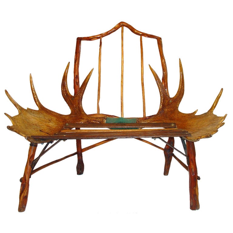 Wonderful moose antler chair or bench from a Canadian hunting lodge.
Fantastic Andirondack decorative folk art chair. 
