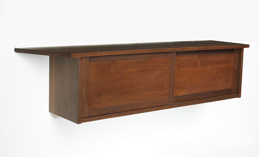 Hanging wall cabinet by George Nakashima