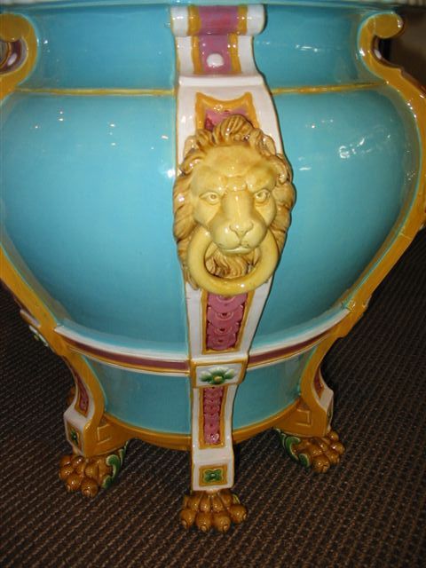 Pair of very large glazed majolica urns with lion head masks;  beautiful blue glaze with gold lion heads;  interior glazed in pinkish lavender