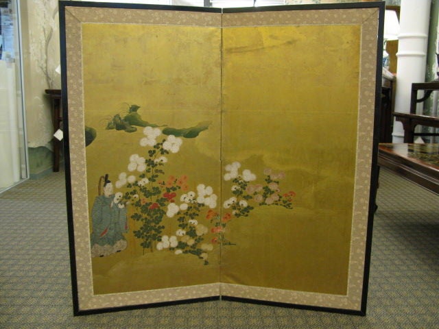 A small and beautiful two panel Japanese screen dating to the 17th century.<br />
<br />
Handpainted design on gold leaf background, depicting a scene from the 