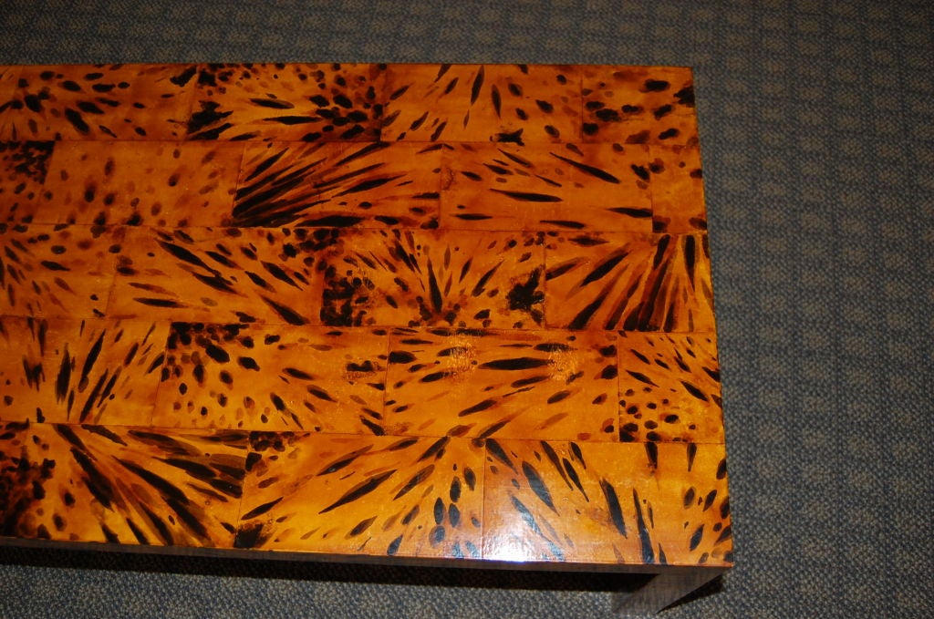 A handmade straight legged waterfall table with handpainted faux tortoise shell in random rectangle pattern.<br />
<br />
The entire surface has a cashew lacquer finish.