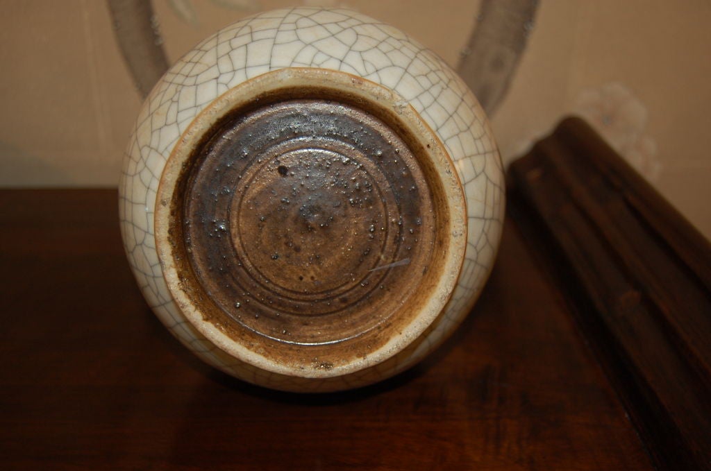 A Chinese 19th century bottle shaped vase. <br />
<br />
Off white glaze with crackled finish.